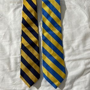 A lot of two preppy, yellow and blue J.Crew ties